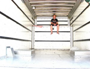 Kid in Moving Truck